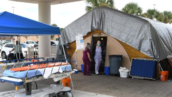 Nurses at a treatment tent outside the emergency department at Holmes Regional Medical Center in Melbourne, Florida, which serves as an overflow area for those with Covid-19 infections.