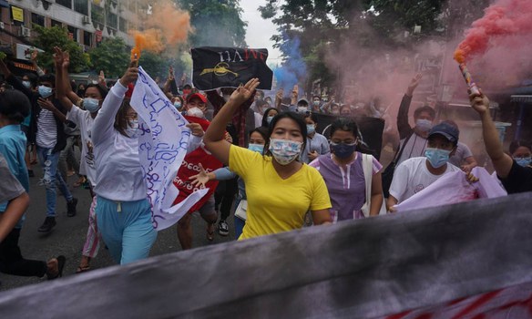 Protesters march in Yangon to demand an end to military rule on the anniversary of a 1962 massacre of students by Myanmar's military, July 7, 2021. RFA