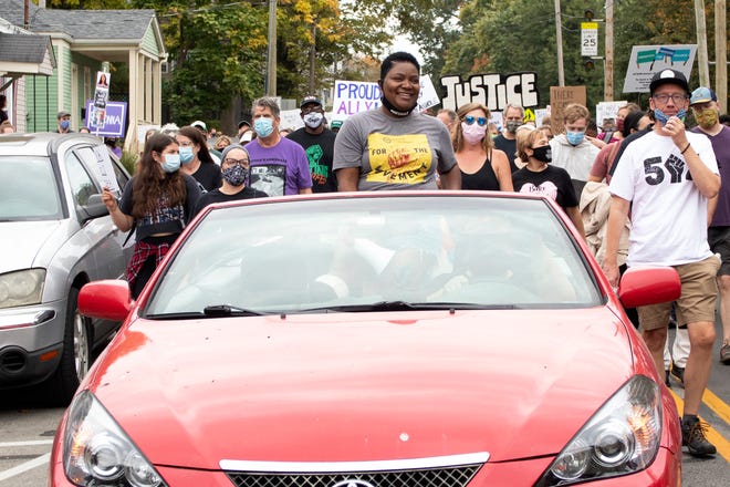 Sadiqa Reynolds, president and CEO of the Louisville Urban League, rode in a convertible during a march for Breonna Taylor in October 2020. She was one of the framers and signers of the Path Forward document, published in June 2020.