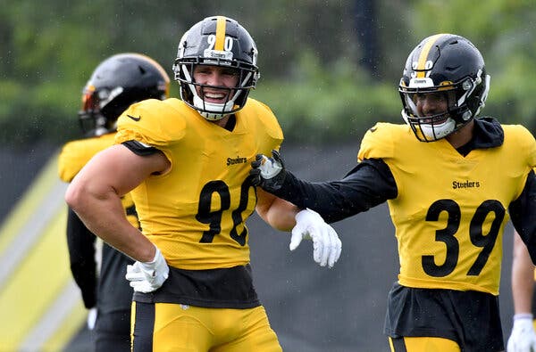 Steelers linebacker T.J. Watt, left, joined teammates including safety Minkah Fitzpatrick during the team’s practice Wednesday, 