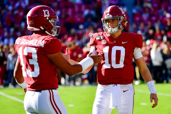 Mac Jones, right, took over the starting quarterback job at Alabama in 2019 when Tua Tagovailoa broke a hip. The pair will square off as N.F.L. pros on Sunday.
