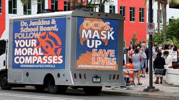 A mobile billboard truck urging the board of Orange County Public Schools to issue a mask mandate in front of the board’s headquarters in downtown Orlando in August.