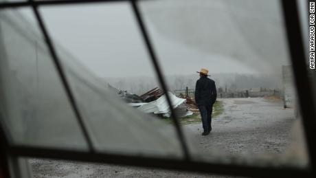 An Amish man walks to unload donations brought by community members in Mayfield, Kentucky.
