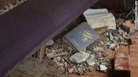 A hymnal lies among the debris in Mayfield.