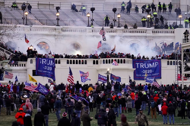 Protesters, loyal to then-President Donald Trump, storm the U.S. Capitol.