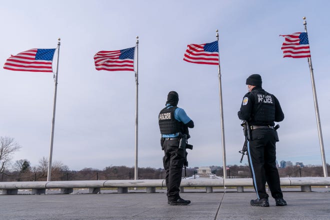 A year after the attack on the U.S. Capitol, U.S. Park Police patrol at the Washington Monument, with the Lincoln Memorial in the background, Thursday, Jan. 6, 2022, along the National Mall in Washington. Thursday marks the first anniversary of the Capitol insurrection, a violent attack that has fundamentally changed Congress and prompted widespread concerns about the future of American democracy.