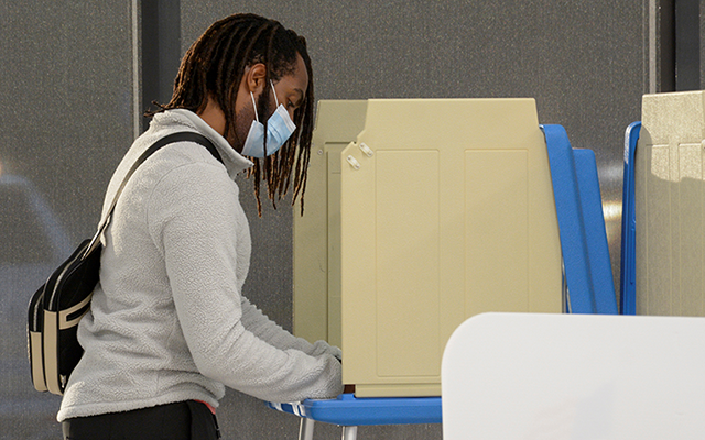 A voter marks his ballot during early voting in Minneapolis on September 18.