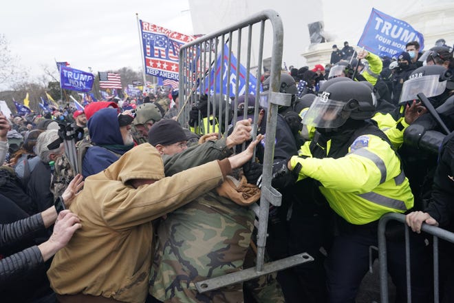 Supporters of former President Donald Trump attack the U.S. Capitol in an effort to overturn the results of the 2020 election on Jan. 6, 2021, in Washington. (Kent Nishimura/Los Angeles Times/TNS)