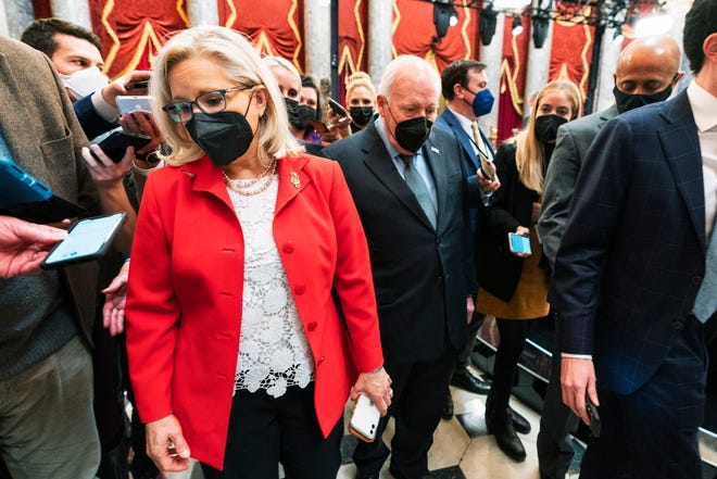 Former Vice President Dick Cheney walks with his daughter Rep. Liz Cheney, R-Wyo., vice chair of the House panel investigating the Jan. 6 U.S. Capitol insurrection, in the Capitol Rotunda at the Capitol in Washington, Thursday, Jan. 6, 2022.