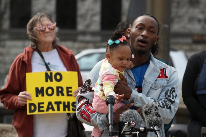 Cane Weitherspoon holds his daughter, Ca'Nari, 10 months, during a press conference and vigil held at Jefferson Square Park to call attention to the eight jail deaths in recent months. Weitherspoon's mother, Stephanie Dunbar died from a suicide at the jail on December 4, 2021.
