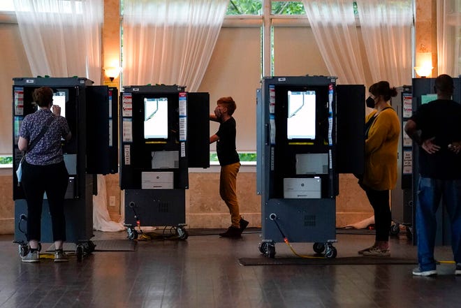 People vote in the Georgia's primary election on Tuesday, May 24, 2022, in Atlanta.