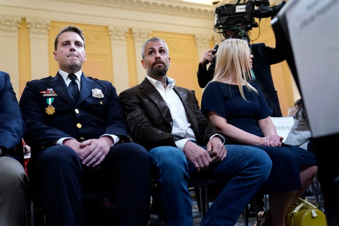 Washington Metropolitan Police Department officer Daniel Hodges, left, and former Washington Metropolitan Police Department officer Michael Fanone arrives as the House select committee investigating the Jan. 6 attack on the U.S. Capitol holds its first public hearing to reveal the findings of a year-long investigation, at the Capitol in Washington, Thursday, June 9, 2022.