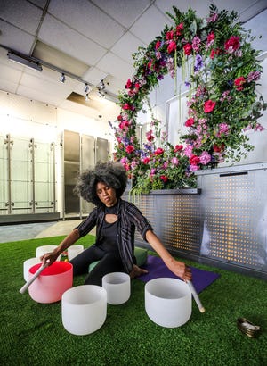 Adriena Dame, a healing arts practitioner, creates a sound bath during the Breonna Taylor immersive experience on Sunday, June 5, 2022