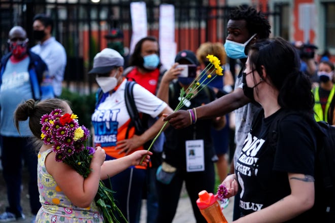 Concerned Citizens for Justice and the Cincinnati Black United Front join to observe the 20th anniversary of the death of Timothy Thomas, Wednesday, April 7, 2021, at Washington Park and near the intersection of 13th and Republic streets in the Over-the-Rhine neighborhood of Cincinnati. Thomas was 19 years old when he was shot on April 7, 2001 by a Cincinnati Police officer. The killing sparked several days protesting and civil unrest.