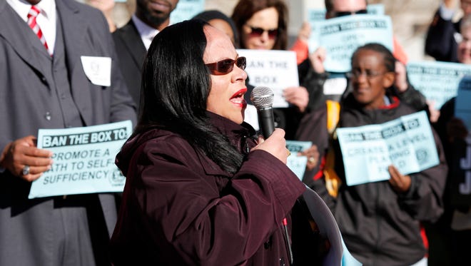 Kathleen Parks, Chair of Kentucky Alliance Against Racist and Political Repression, speaks during a rally in front of Louisville Metro Hall before a Metro Council meeting expected to vote on the