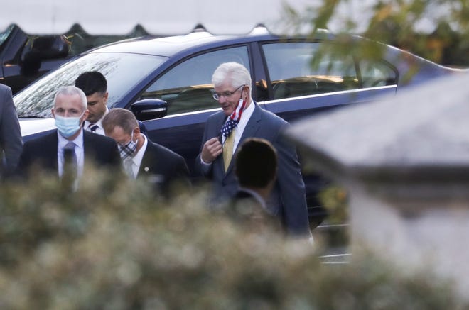 Michigan State Senate Majority Leader Mike Shirkey adjusts his protective face mask as he arrives to meet with U.S. President Donald Trump at the White House in Washington, U.S., November 20, 2020.