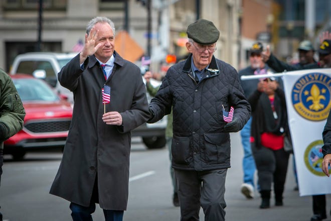 Louisville Mayor Greg Fischer, left, and his father George Fischer during a Veteran’s Day Parade.
