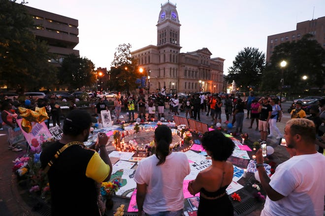 Protesters gathered around lighted candles at Breonna's Circle in Jefferson Square Park on July 16, 2020 to mark the 50th day of protests following the death of Breonna Taylor at the hands of LMPD.