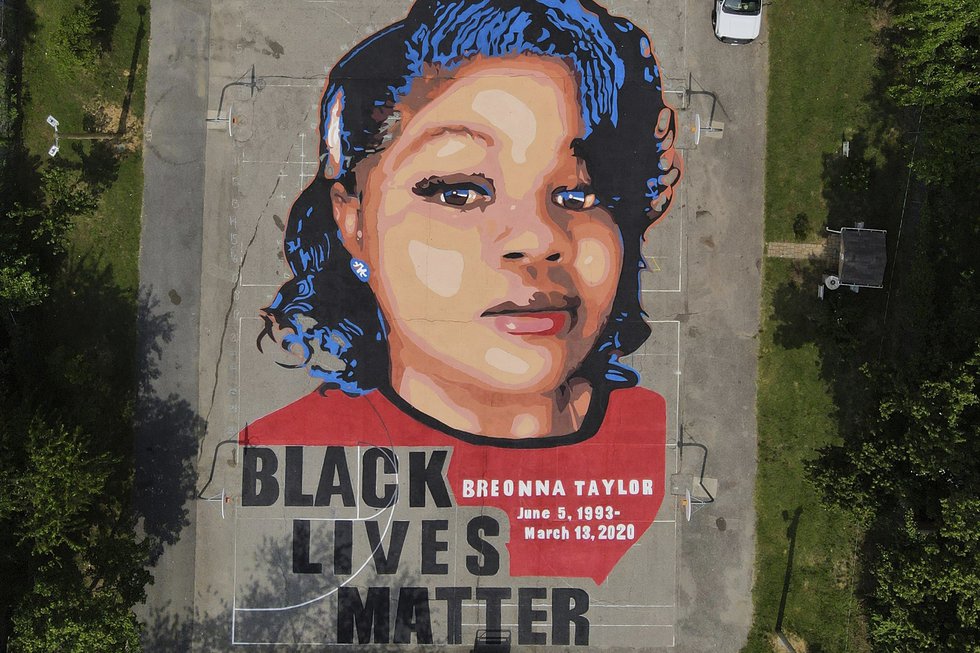 FILE - A ground mural depicting a portrait of Breonna Taylor is seen at Chambers Park in...
